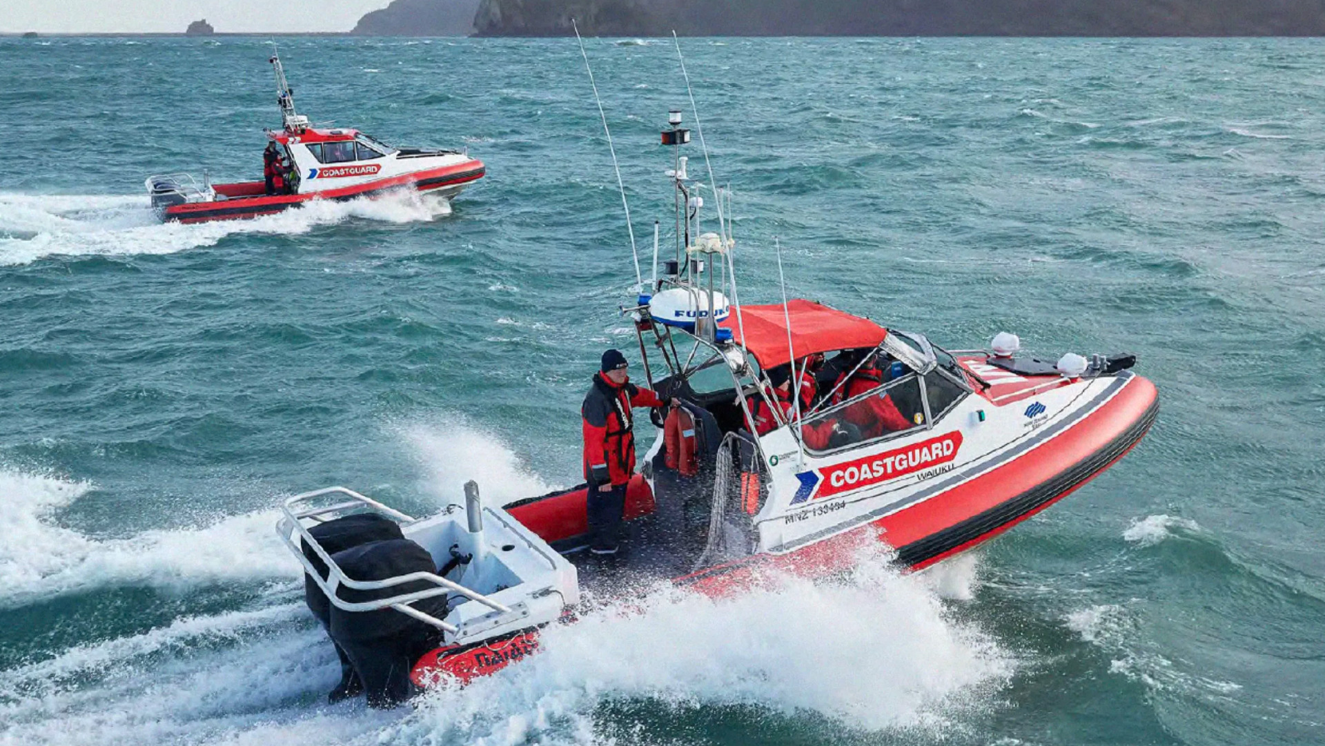 New Zealand Coastguard rescue boats at sea.