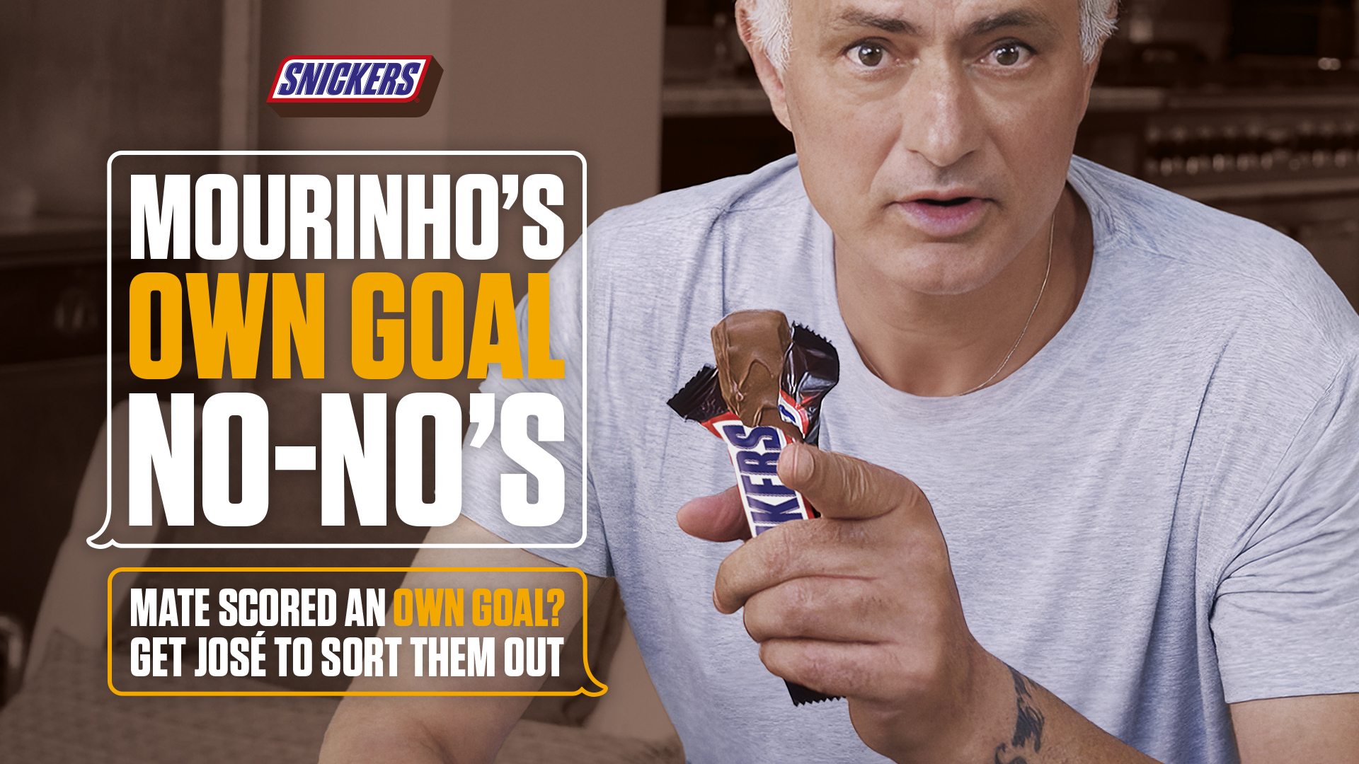 José Mourinho holds a Snickers bar beside the words ‘Mourinho’s Own Goal No-No’s.’